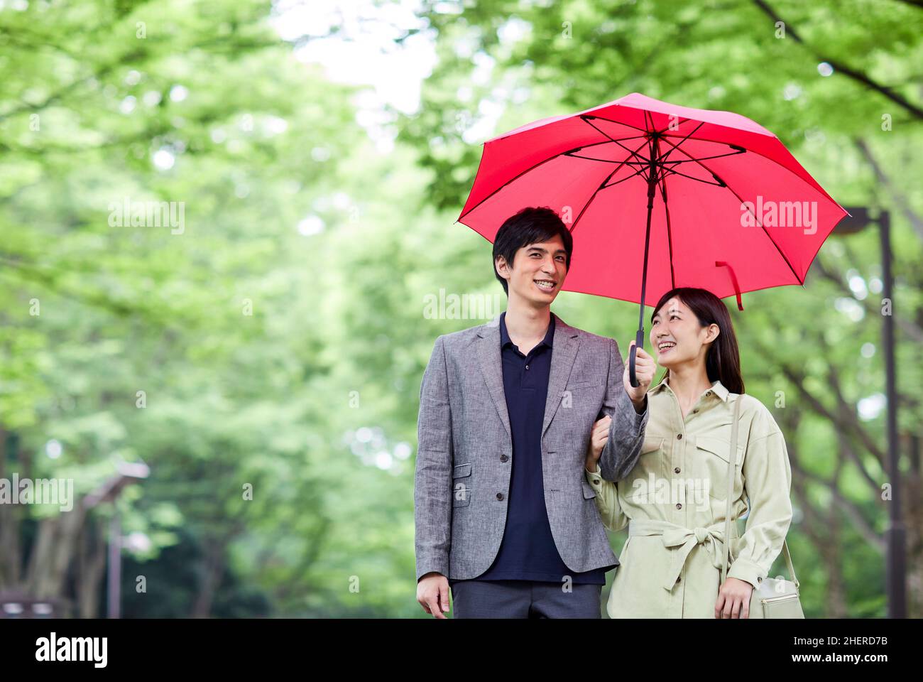 Japanese Couple Taking A Walk In The Park Stock Photo - Alamy