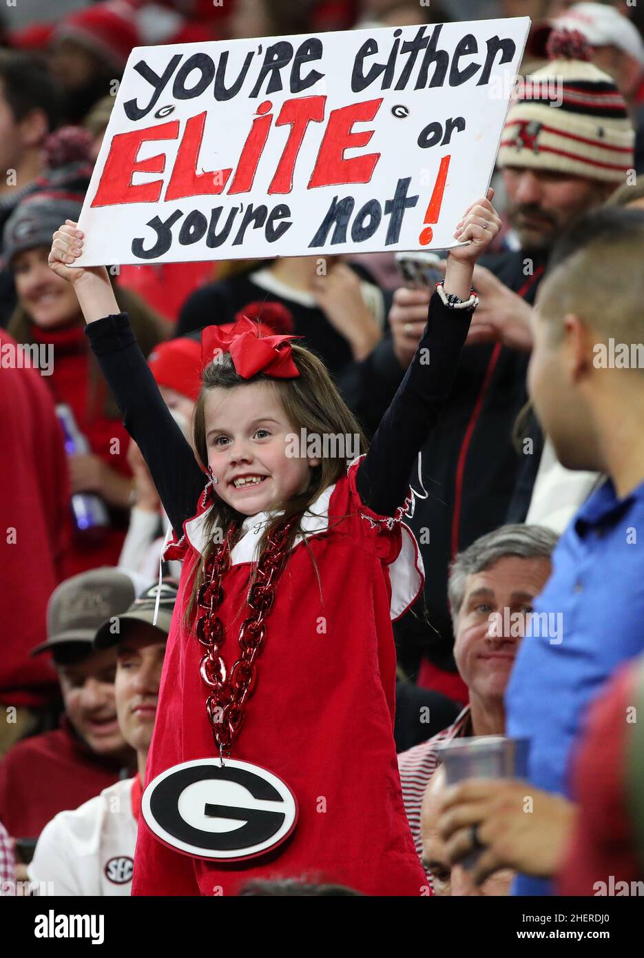 A Georgia Bulldogs fan holds a sign during the 2022 CFP college football national championship game at Lucas Oil Stadium, Monday, Jan. 10, 2022, in In Stock Photo
