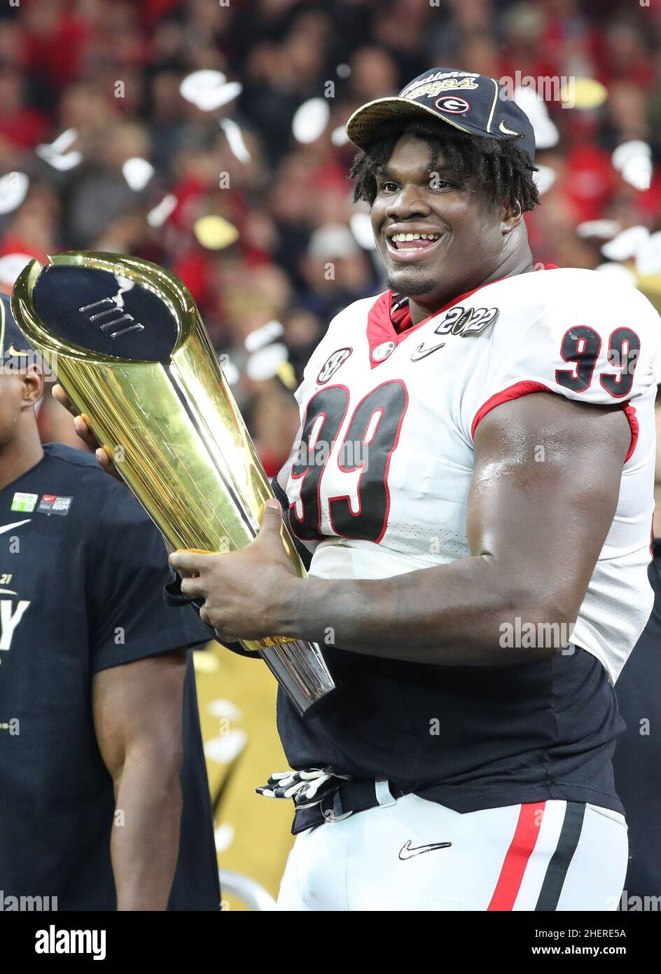 Georgia Bulldogs defensive lineman Jordan Davis (99) celebrating during the  trophy presentation of the 2022 CFP college football national championship  game at Lucas Oil Stadium, Monday, Jan. 10, 2022, in Indianapolis. Georgia