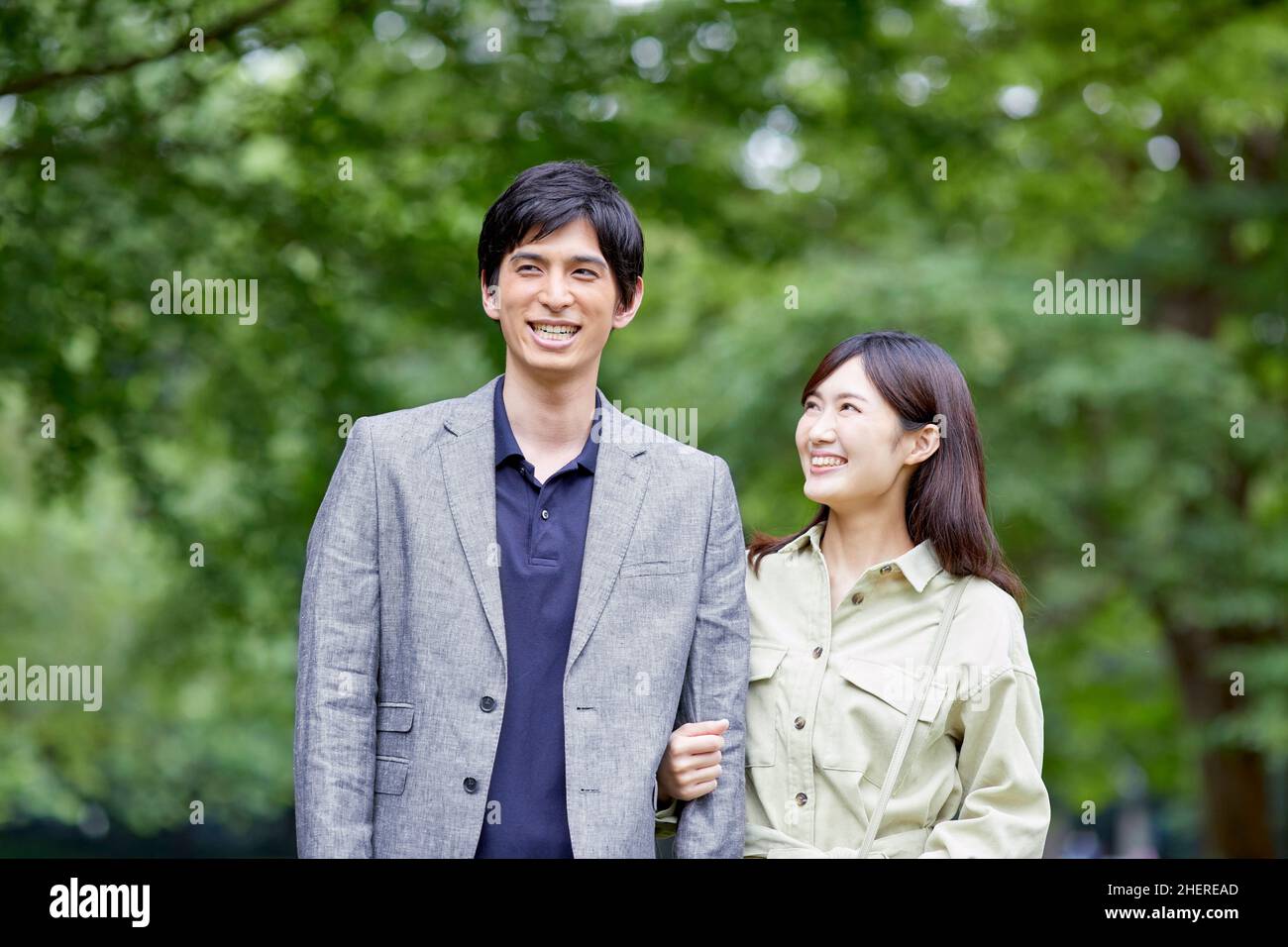 Japanese Couple Taking A Walk In The Park Stock Photo - Alamy
