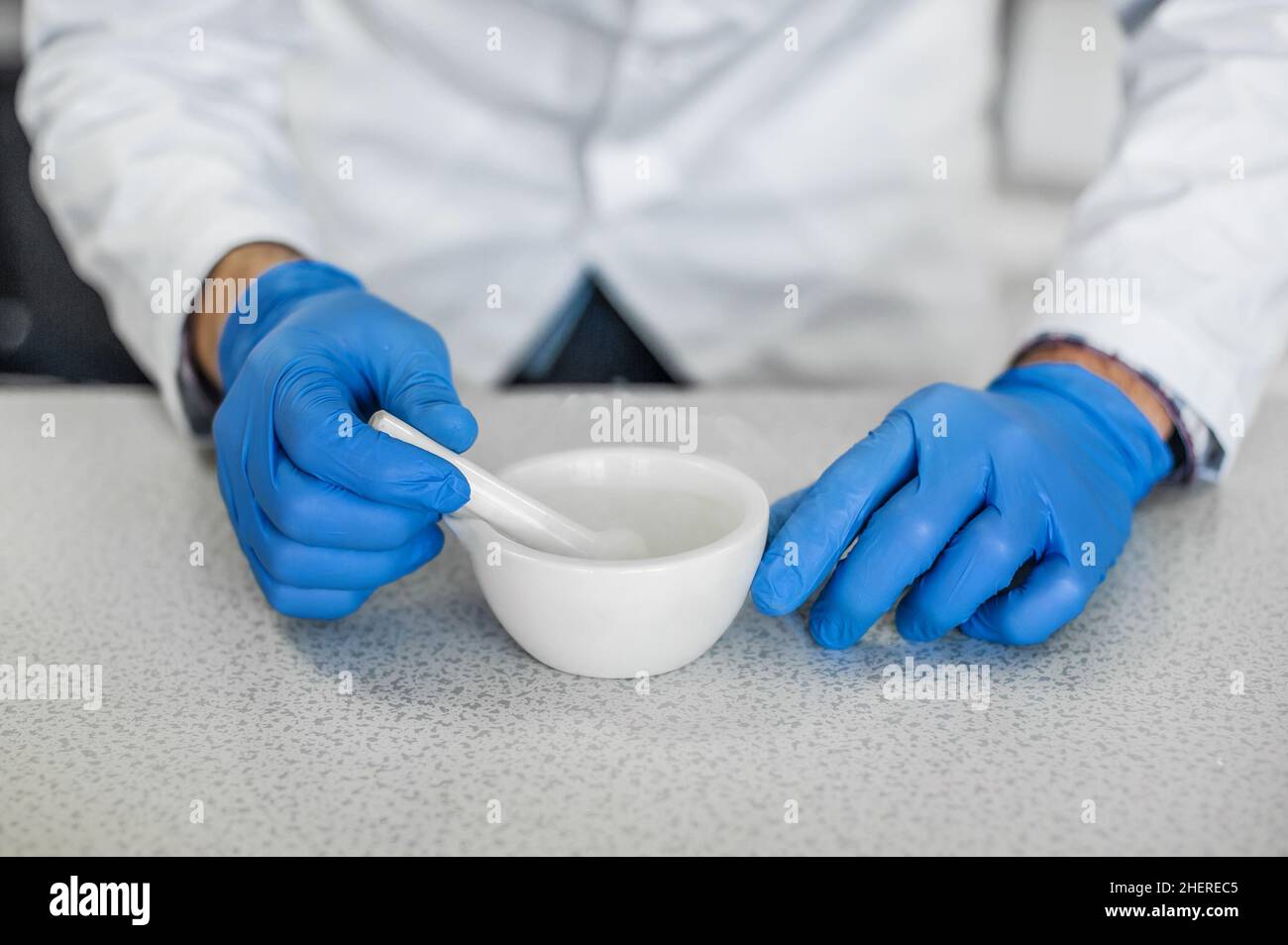Chemist performs an experiment with liquid nitrogen in laboratory