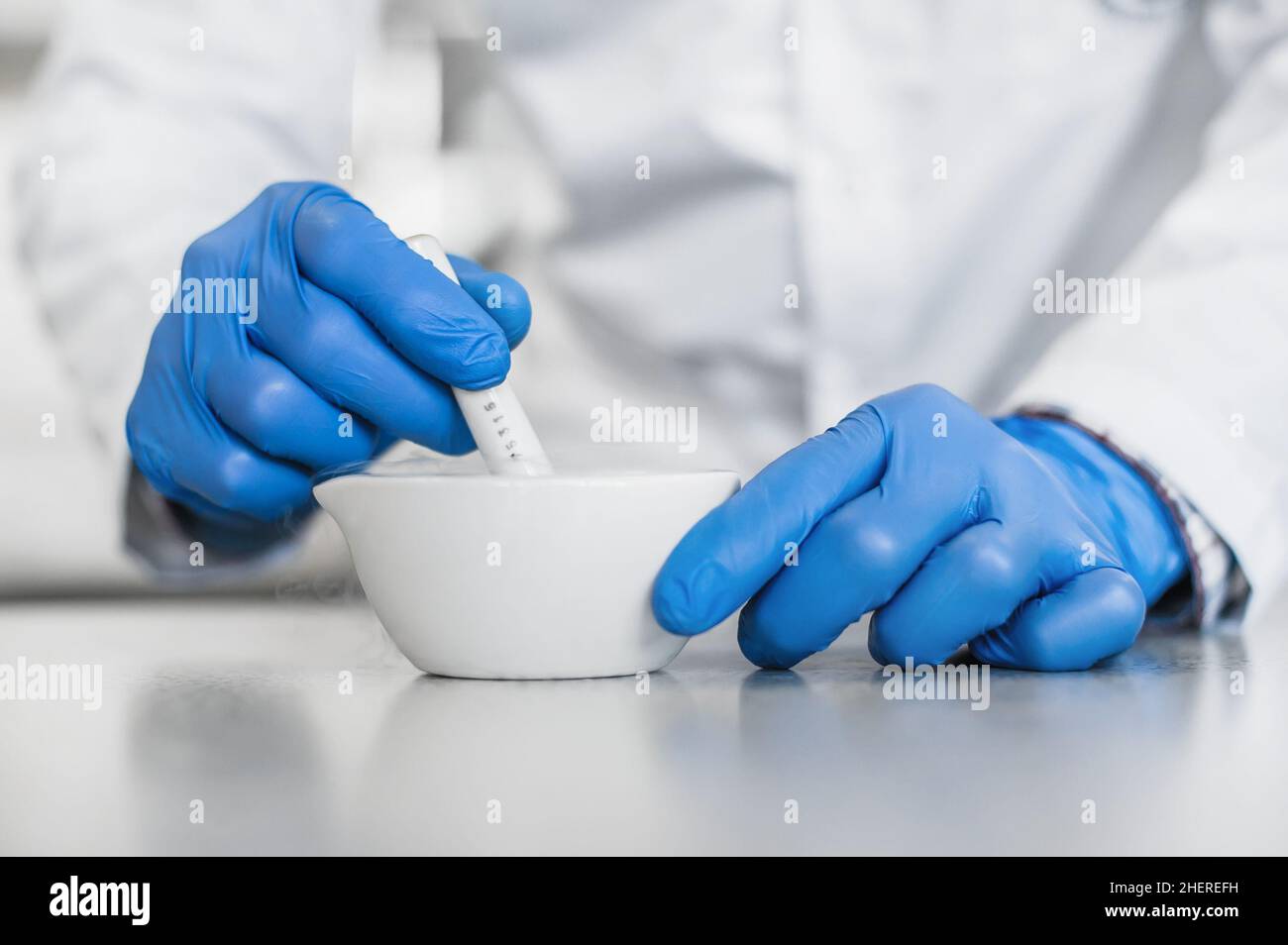 Chemist performs an experiment with liquid nitrogen in laboratory