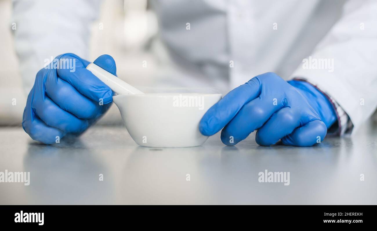 Chemist performs an experiment with liquid nitrogen in laboratory