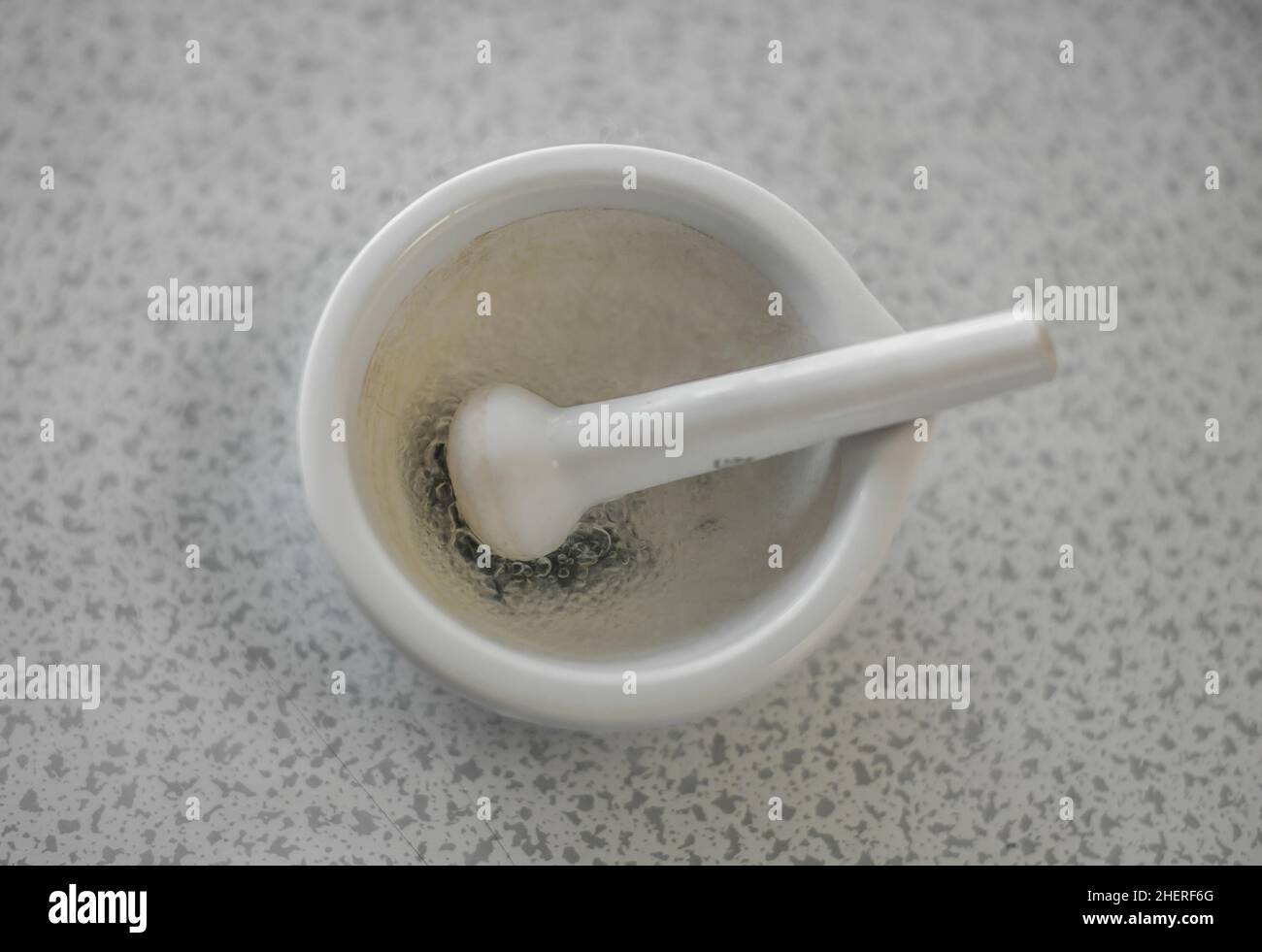 Laboratory experiment with liquid nitrogen in laboratory mortar with