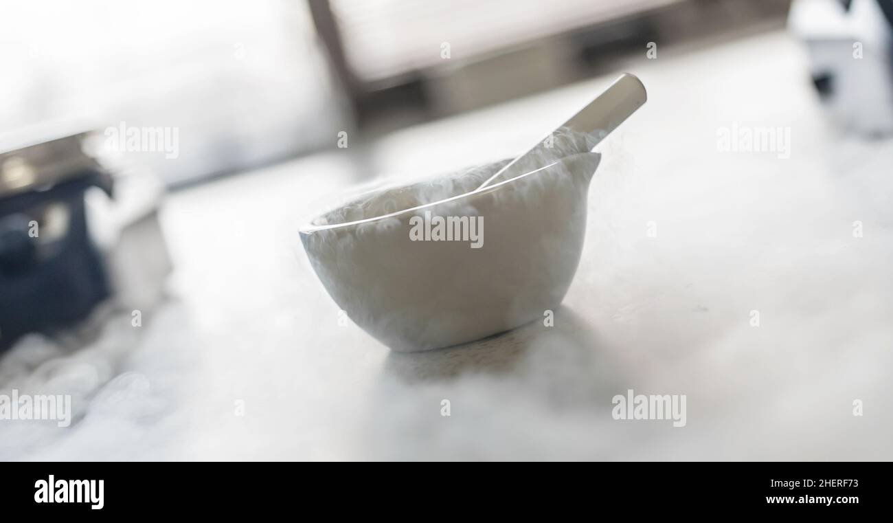 Laboratory experiment with liquid nitrogen in laboratory mortar with