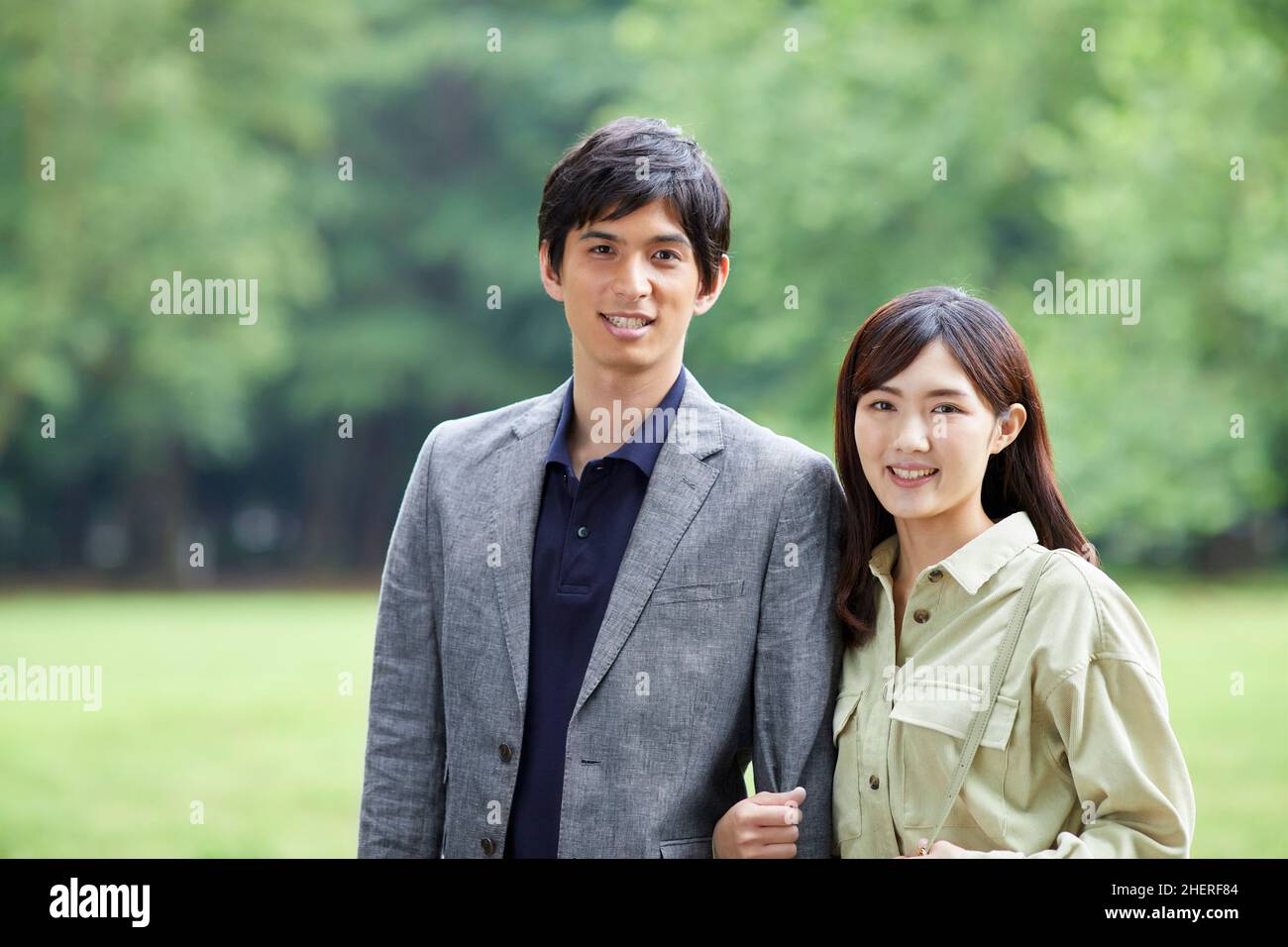 Japanese Couple Taking A Walk In The Park Stock Photo - Alamy