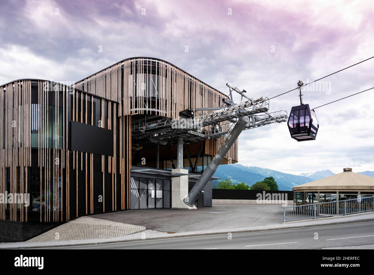 valley station of modern ropeway with gondola with cloudy sky in tirol mountains Stock Photo