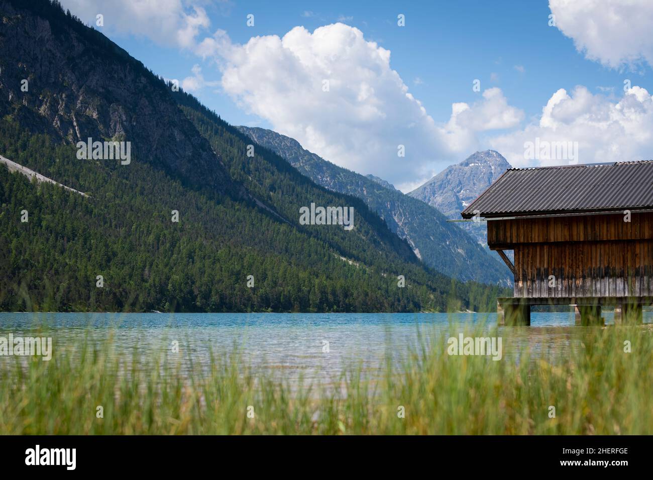 rural wooden boat house at wonderful mountain lake plansee  in tirol austria Stock Photo