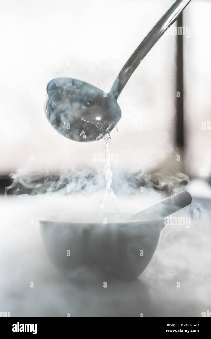 Laboratory experiment with liquid nitrogen in laboratory mortar with