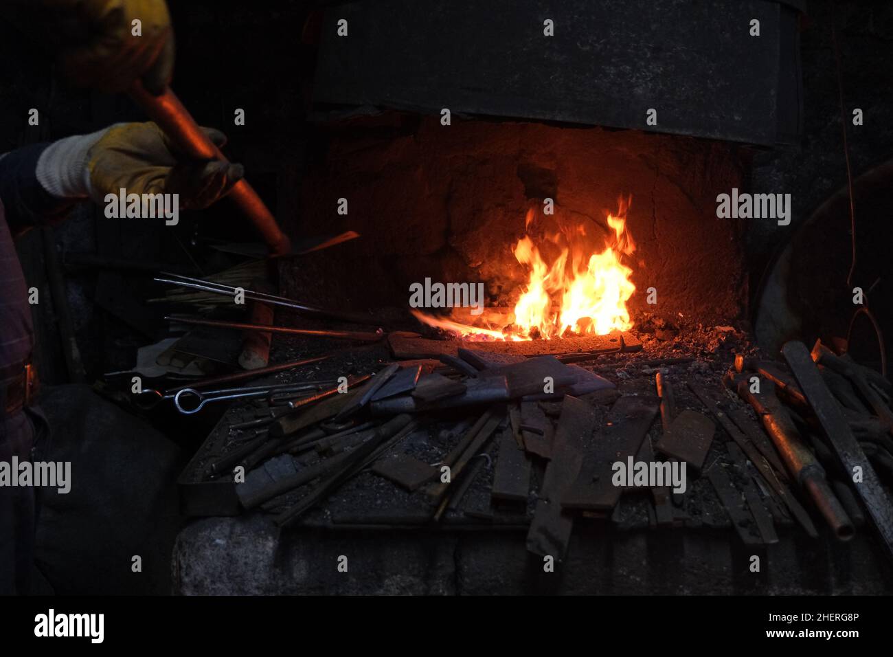 Metal work, fire and iron and wrought iron in fire furnace Stock