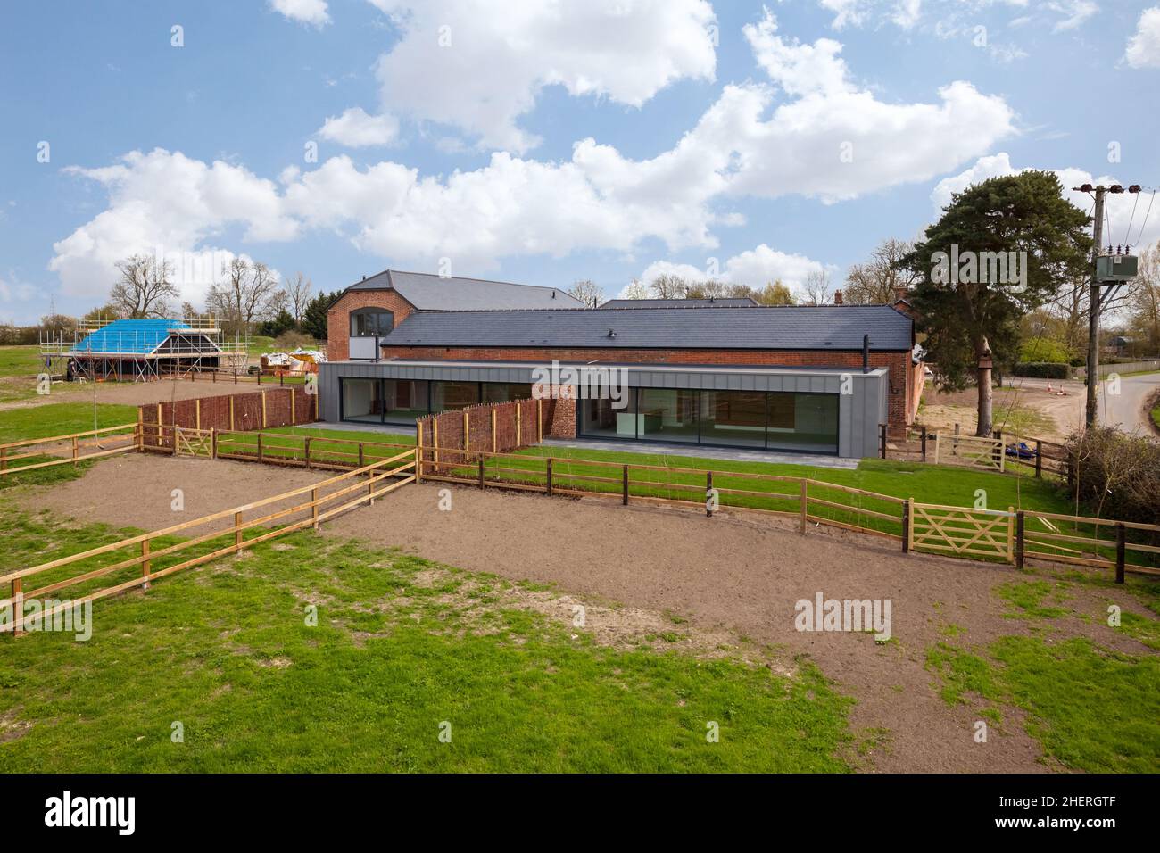 Cowlinge, Suffolk, England - 9 April 2019: Aerial view of stylish brick ...