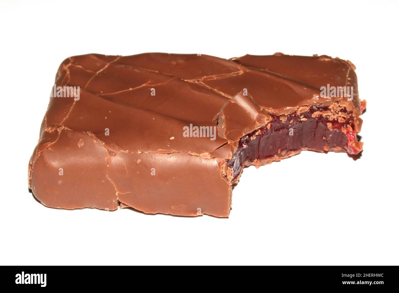 A Bitten Half Eaten Chocolate Bar with Cherry Jelly Inside on White Background Stock Photo