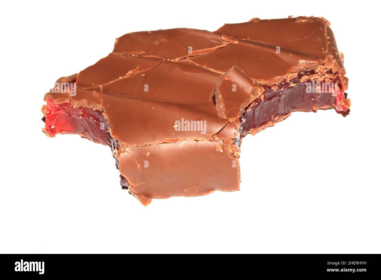 A Bitten Half Eaten Chocolate Bar with Cherry Jelly Inside on White Background Stock Photo