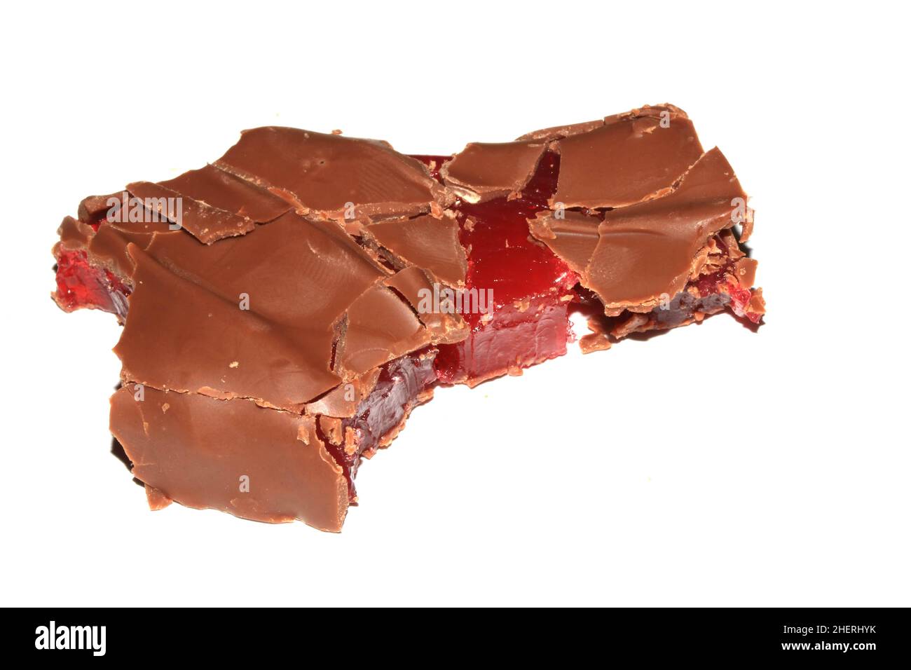 A Bitten Half Eaten Chocolate Bar with Cherry Jelly Inside on White Background Stock Photo