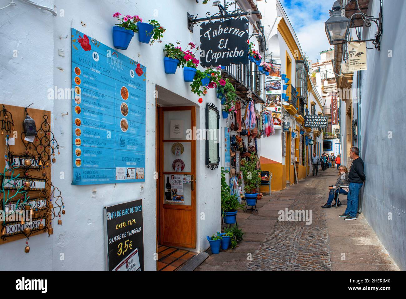 Shops bars and restaurants outside the La Mezquita Cathedral Mosque in the historic old town La Juderia, Cordoba, Andalucia, Spain.  Dance and celebra Stock Photo