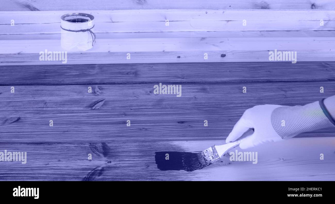 The process of painting wood surfaces with a brush Stock Photo Alamy