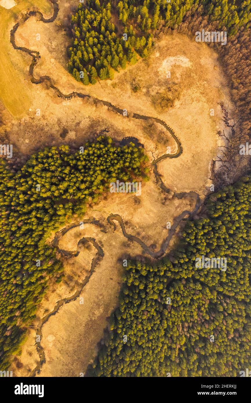 Aerial of a river winding through rural landscape. River valley shot from a drone. Stock Photo