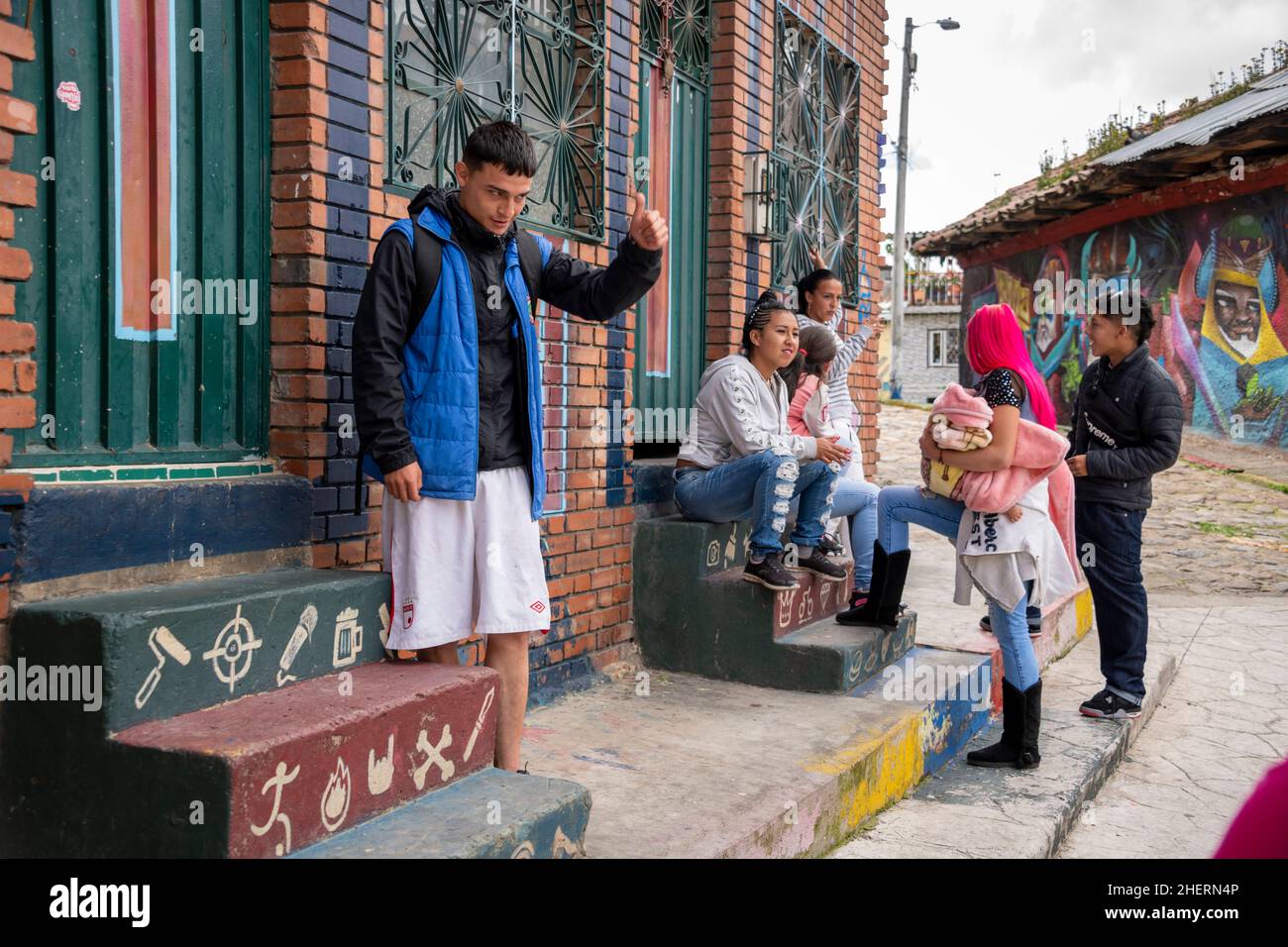 Group of young people with baby in the once notorious gang Barrio Egipto neighbourhood, Bogota, Colombia, South America. Stock Photo