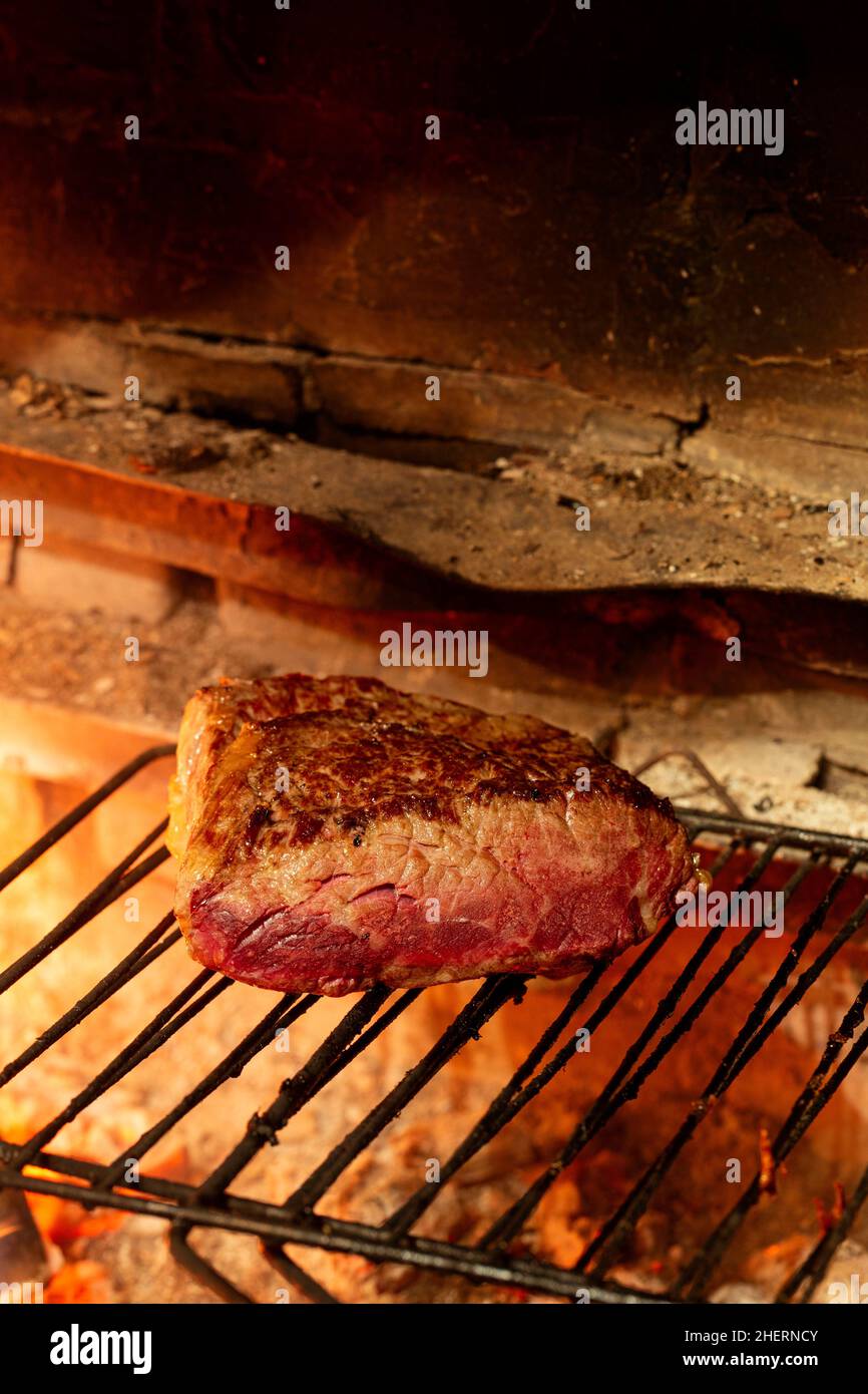 Delicious beef fillet on a charcoal grill grid. Tasty beef steak