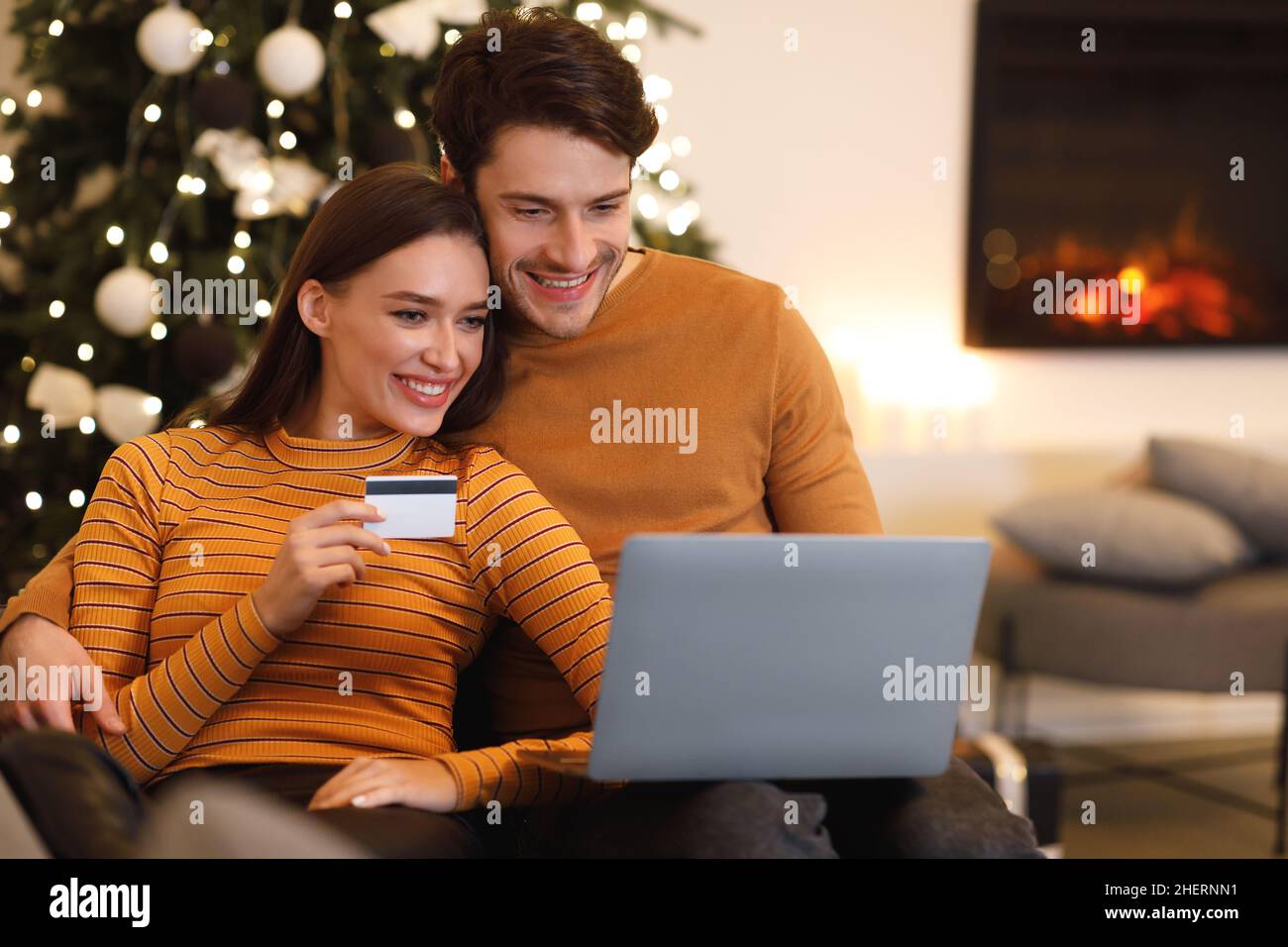 happy couple using pc and debit credit card at home Stock Photo - Alamy