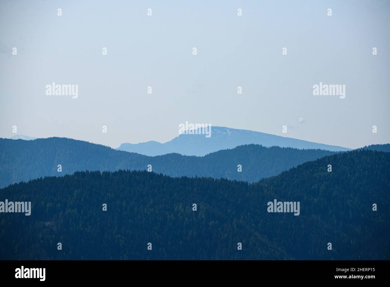 silhouette shades of thre mountain chains in south tyrol Stock Photo