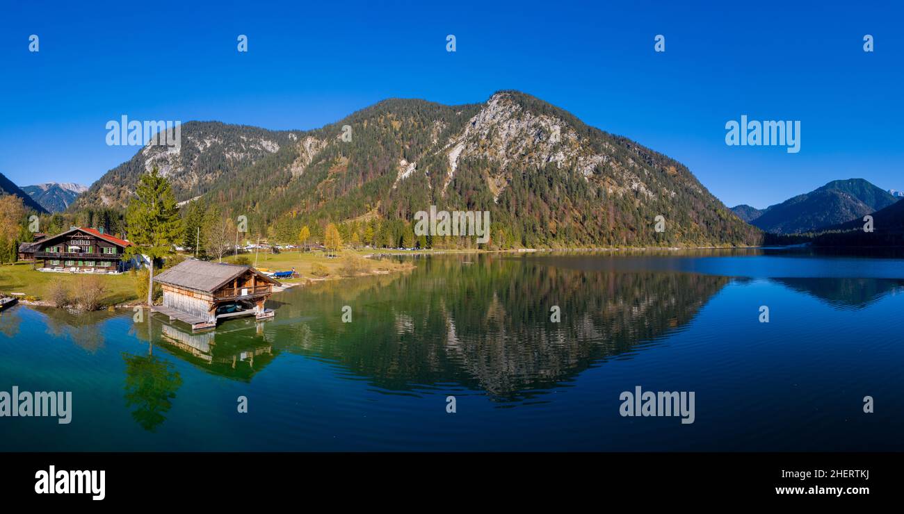 aerial view to boathouse at lake plansee in fall mood with great ...