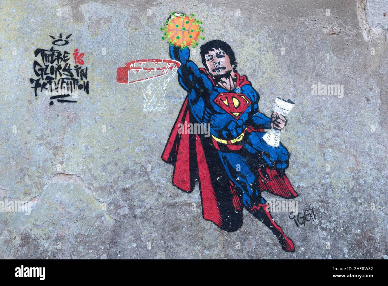 Superman plays basketball with a virus, graffiti on a wall, Lauf an der Pegnitz, Middle Franconia, Bavaria, Germany as Stock Photo