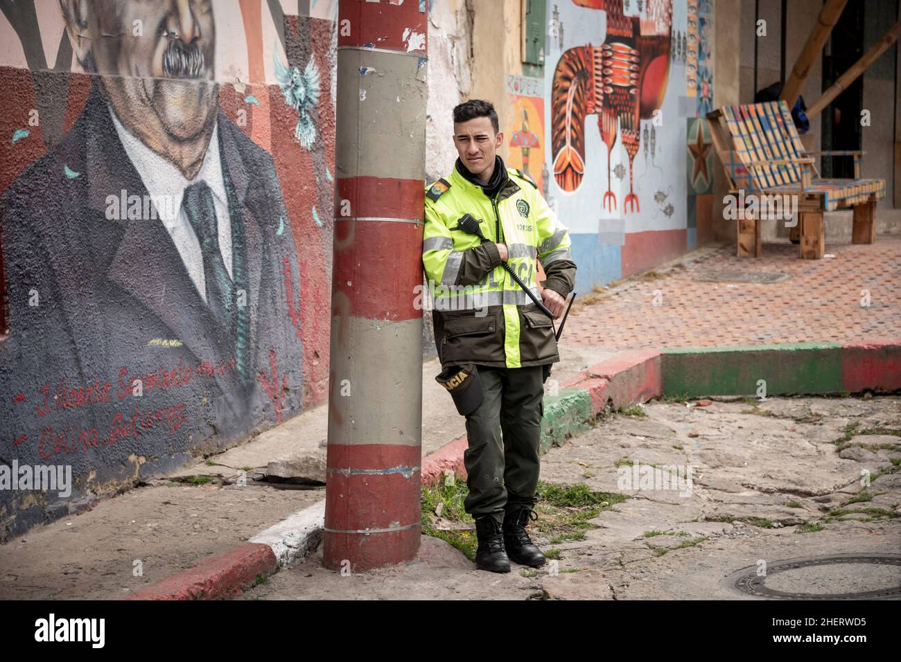 Policeman on guard patrol of the once notorious gang and criminal Barrio Egipto, Bogota, Colombia. Stock Photo