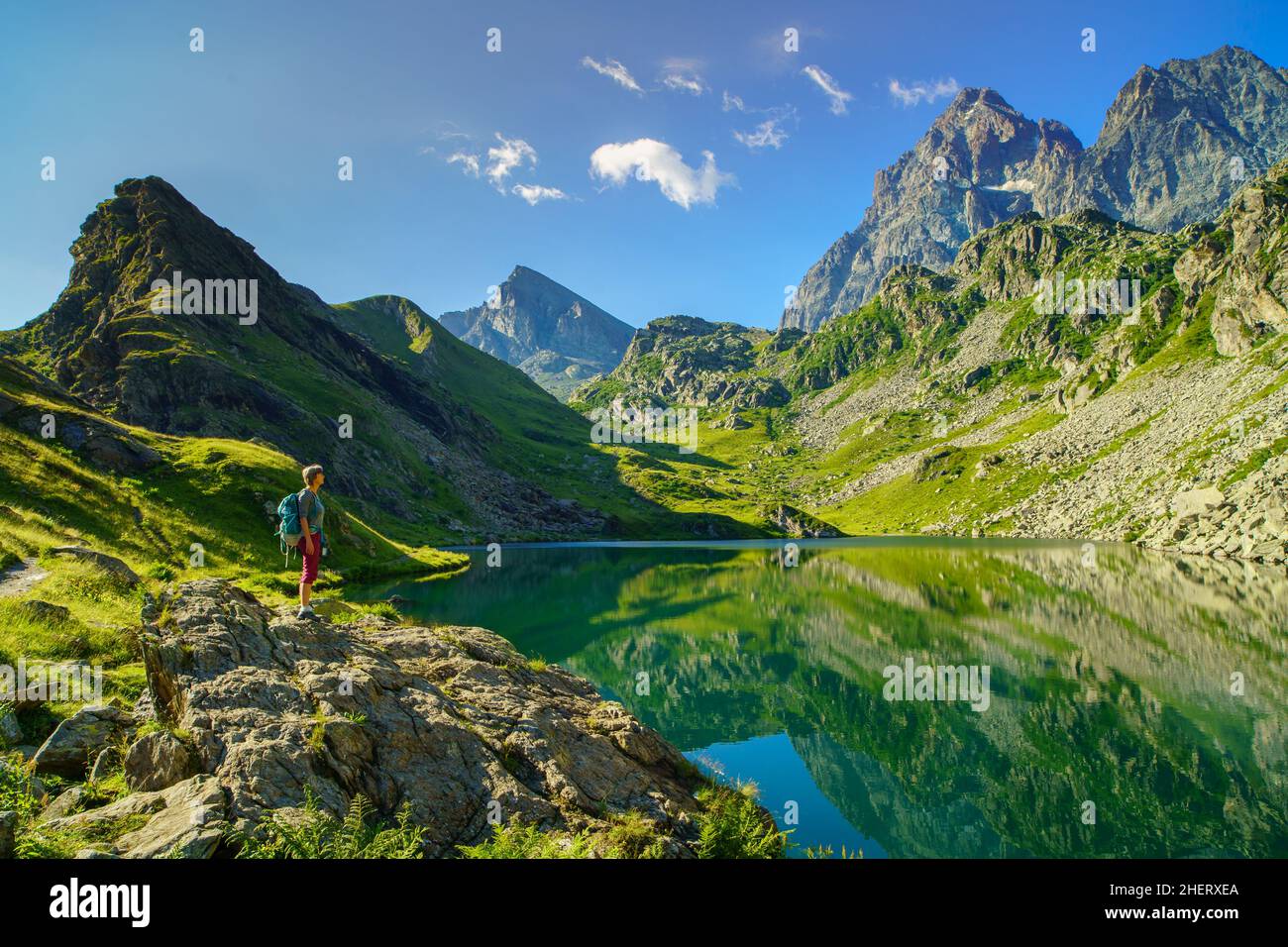 Trekker on Lake Fiorenza, Monviso (Italy) Stock Photo