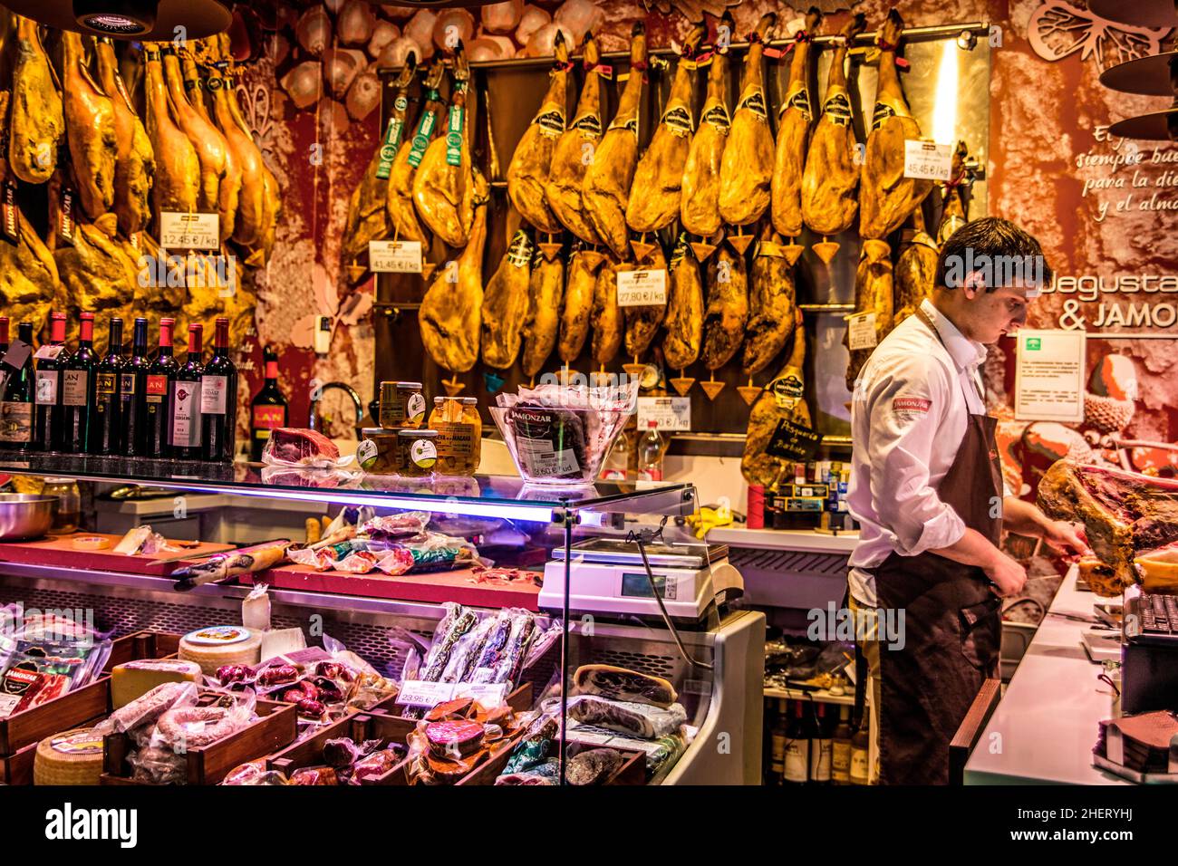 Shop with Serrano ham, Mercado San Agustin in Granada, Andalusia, Spain Stock Photo