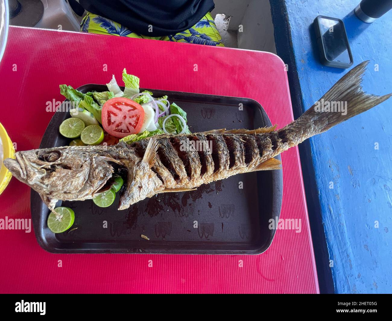 Curvina fish, fried sea bass in a fish and seafood restaurant on Kino