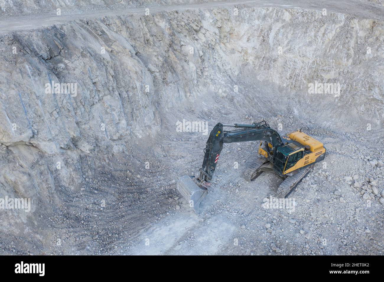 aerial view to heavy mine bucket chain digger with shovel at stone pit
