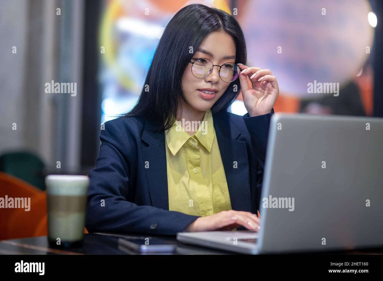 Asian business woman in the office working on a laptop Stock Photo - Alamy