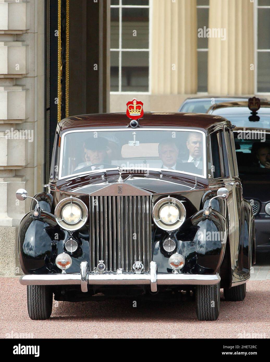 Prince Andrew the Queen's son accompanied by his daughters Princess Eugenie and Princess Beatrice as they leave Buckingham Palace by immaculate vintage Rolls Royce to commemorate the 60th anniversary of the accession of the Queen, London. 5 June 2012 --- Image by © Paul Cunningham Stock Photo
