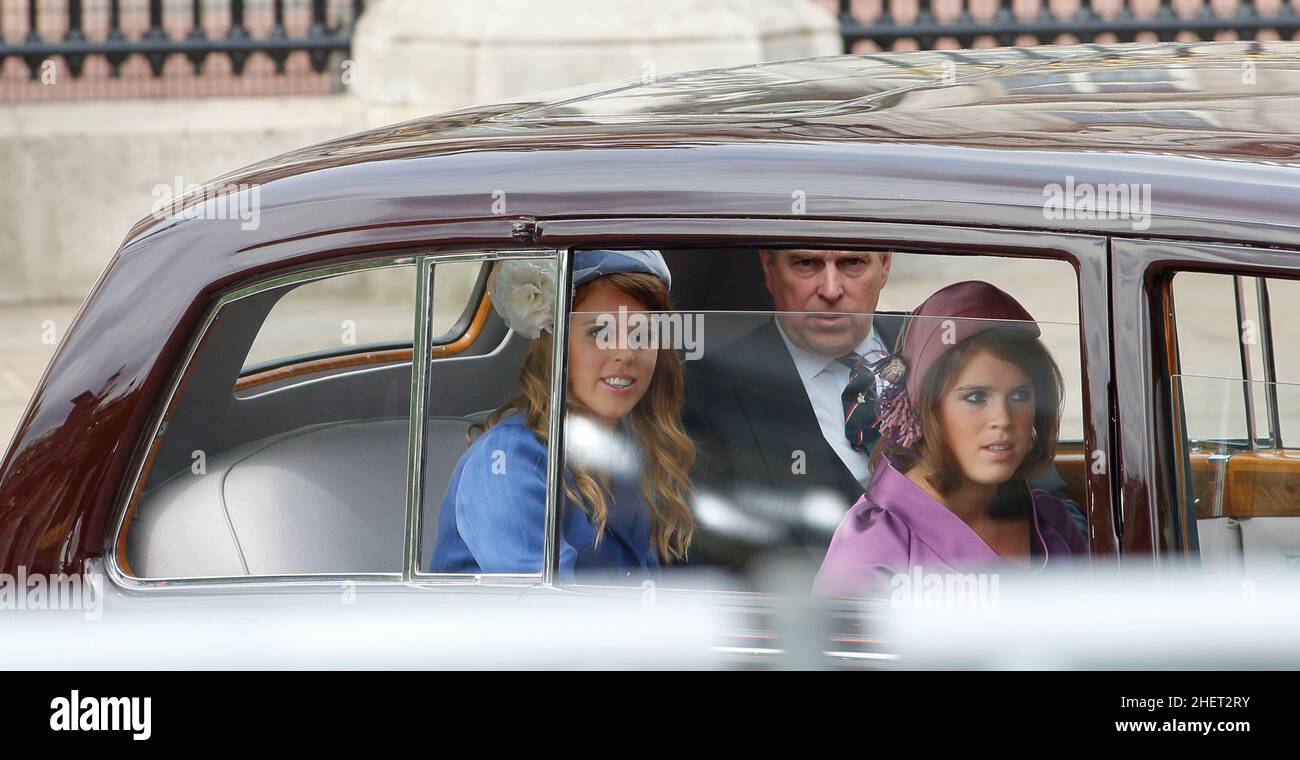 Prince Andrew the Queen's son accompanied by his daughters Princess Eugenie and Princess Beatrice as they leave Buckingham Palace by immaculate vintage Rolls Royce to commemorate the 60th anniversary of the accession of the Queen, London. 5 June 2012 --- Image by © Paul Cunningham Stock Photo