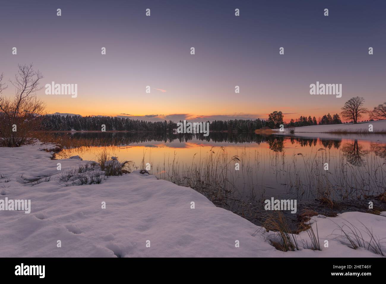 sunset of idyllic small lake at winter in bavaria Stock Photo