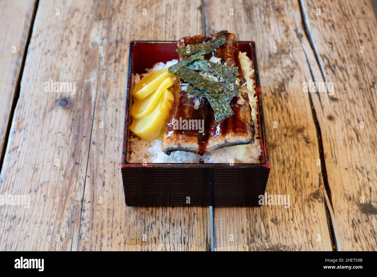 Unagi Rice : Japanese freshwater eel served with rice, nori seawedd sheet strips and water chestnut Stock Photo