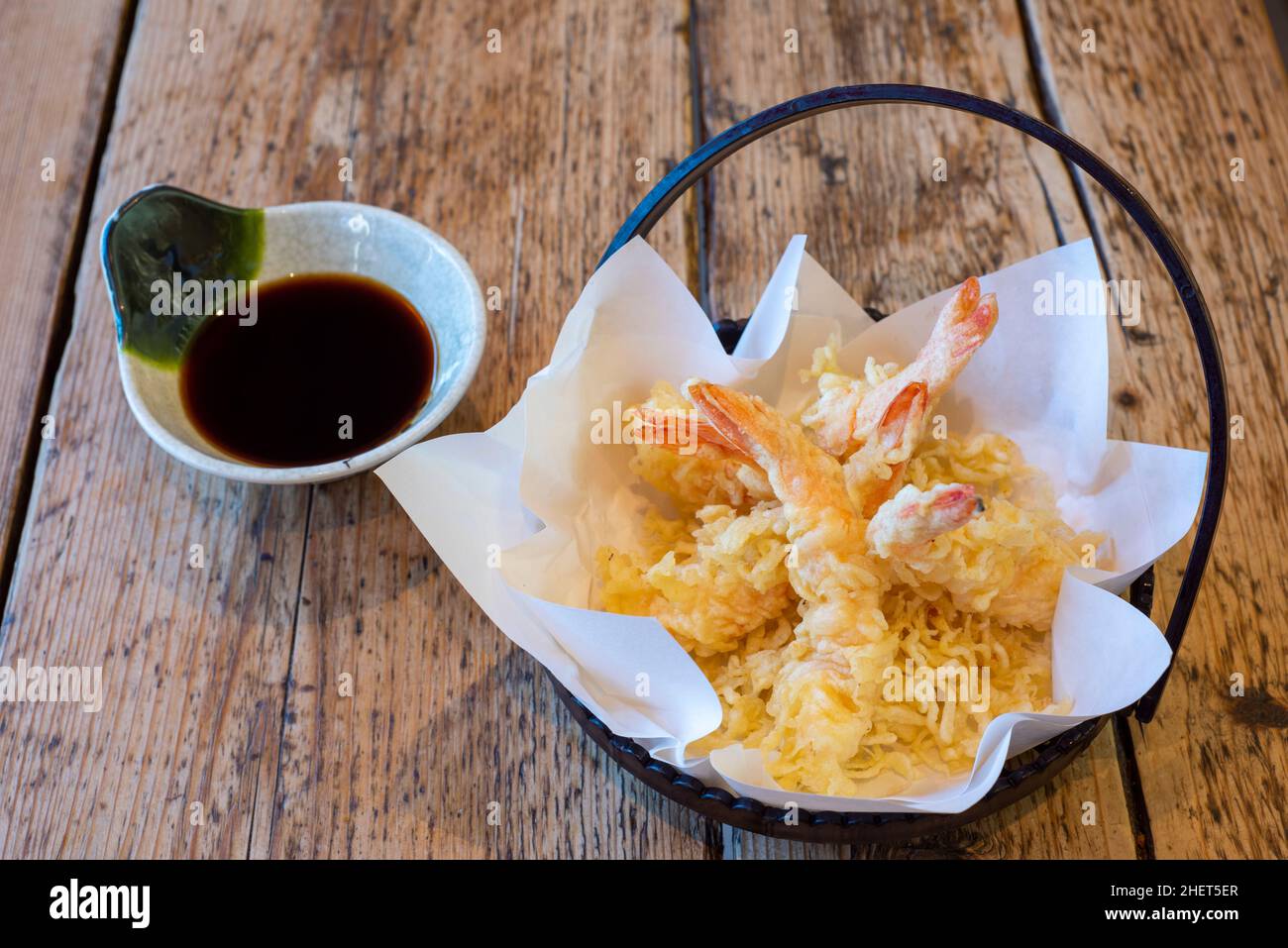 Japanese Asian cuisine : tempura battered prawns served in a basket with soy dipping sauce Stock Photo
