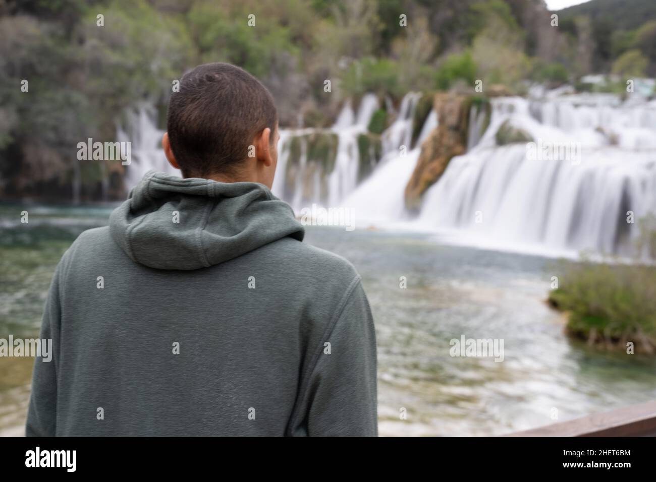 Black male african american tourist looking at the waterfalls at krka national park, Croatia. Stock Photo
