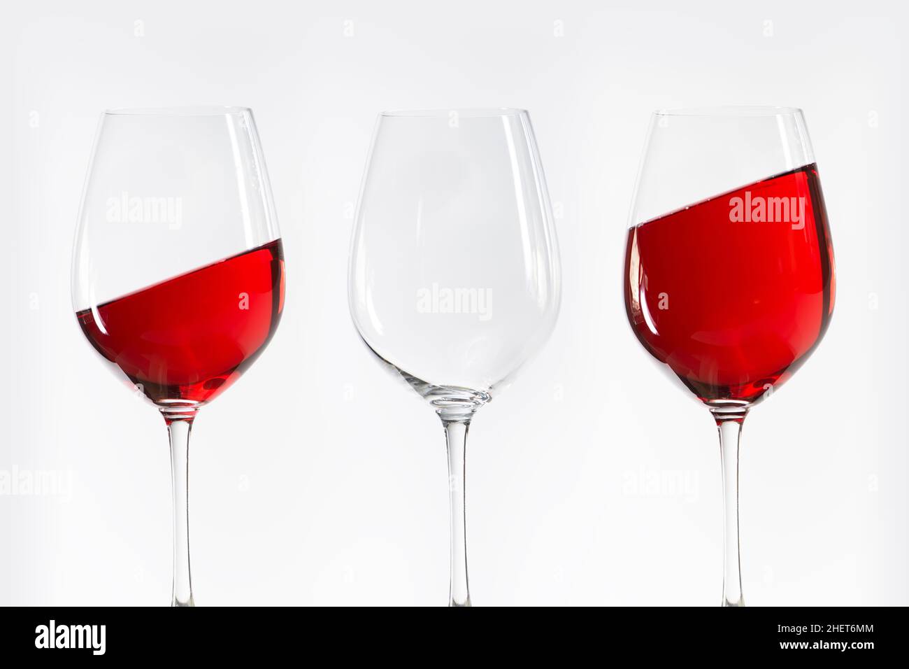 three red white wine glasses standing in a row Stock Photo Alamy