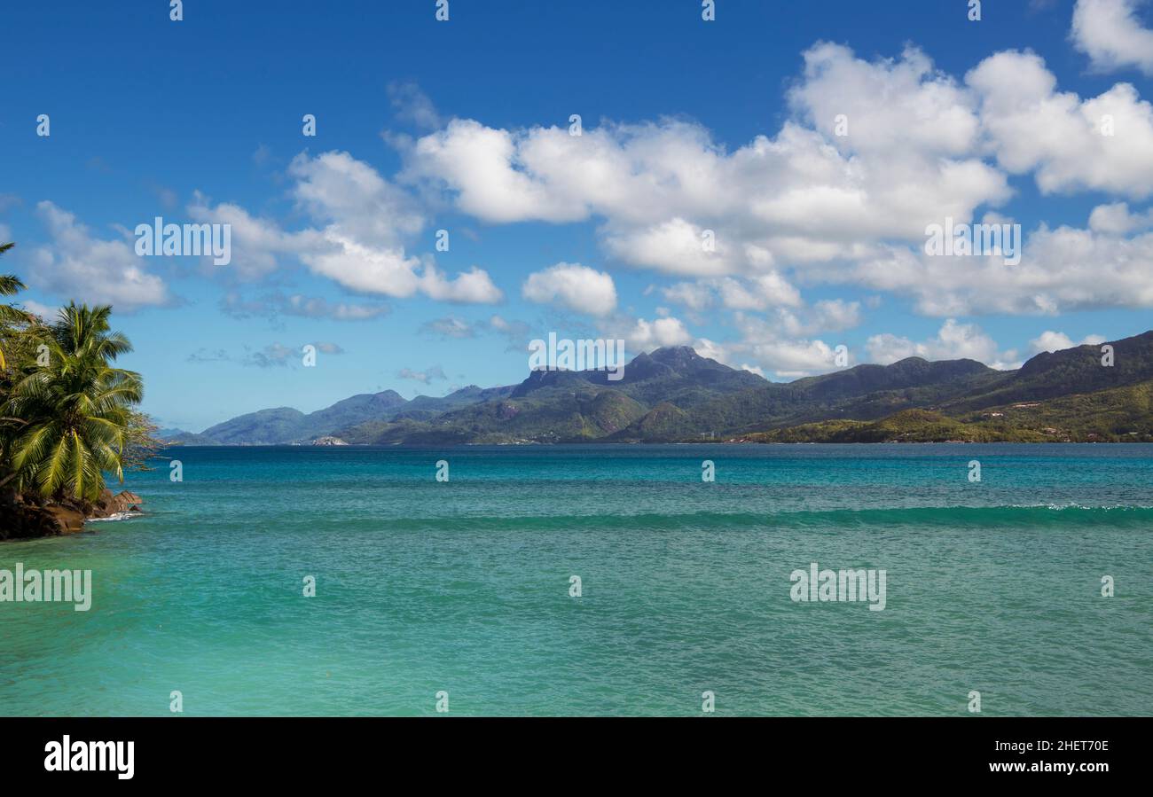 Turquoise sea Anse a la Mouche and mountains west coast Mahe Seychelles Stock Photo