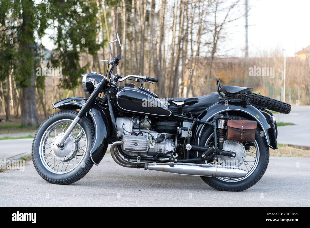 sideview of black oldtimer motorbike with sidecar an leather bag Stock Photo