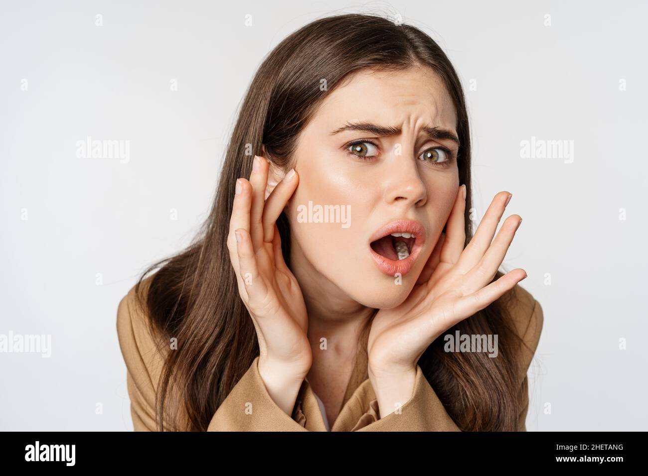 Image of sad girl looking in mirror and touching facial skin, shocked and frustrated over bad