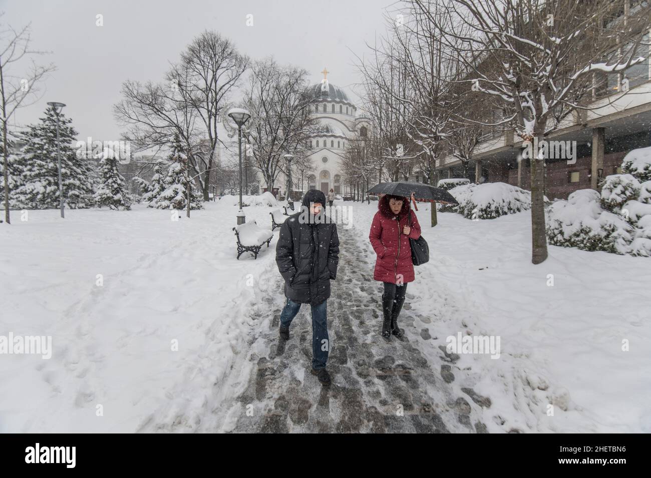 Winter in Serbia People walking in Saint Sava Park during a snow fall