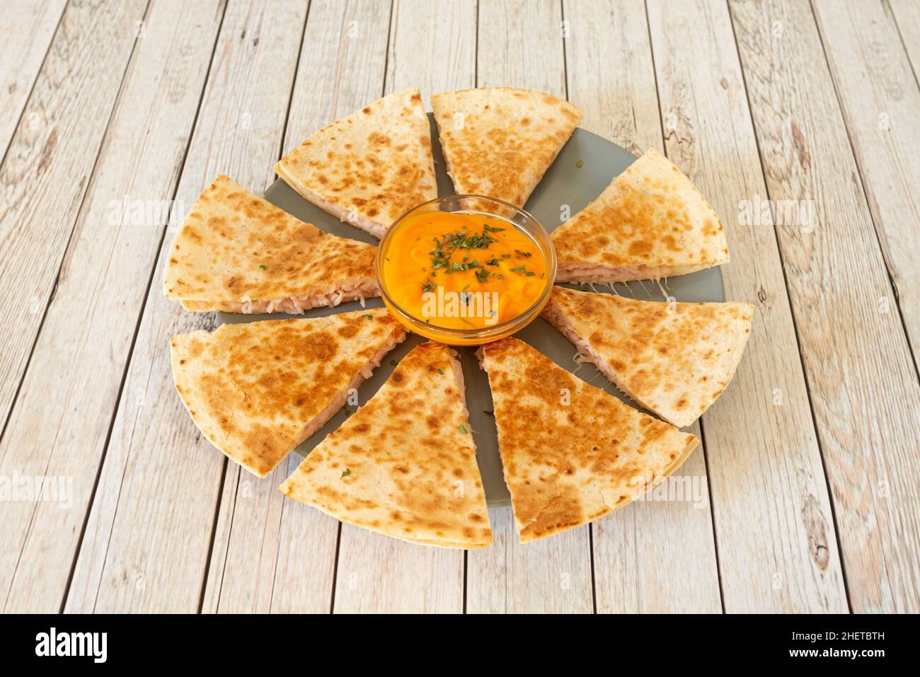 The quesadilla is a Mexican dish of corn or wheat tortilla, folded in