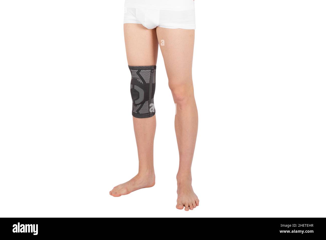 Knee Support Brace on leg isolated on white background. Orthopedic