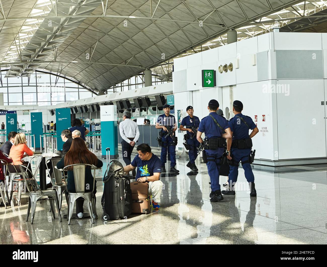 Hong Kong International Airport is one of the largest  passenger hub in China  and this requires the strict control of the military police. Stock Photo