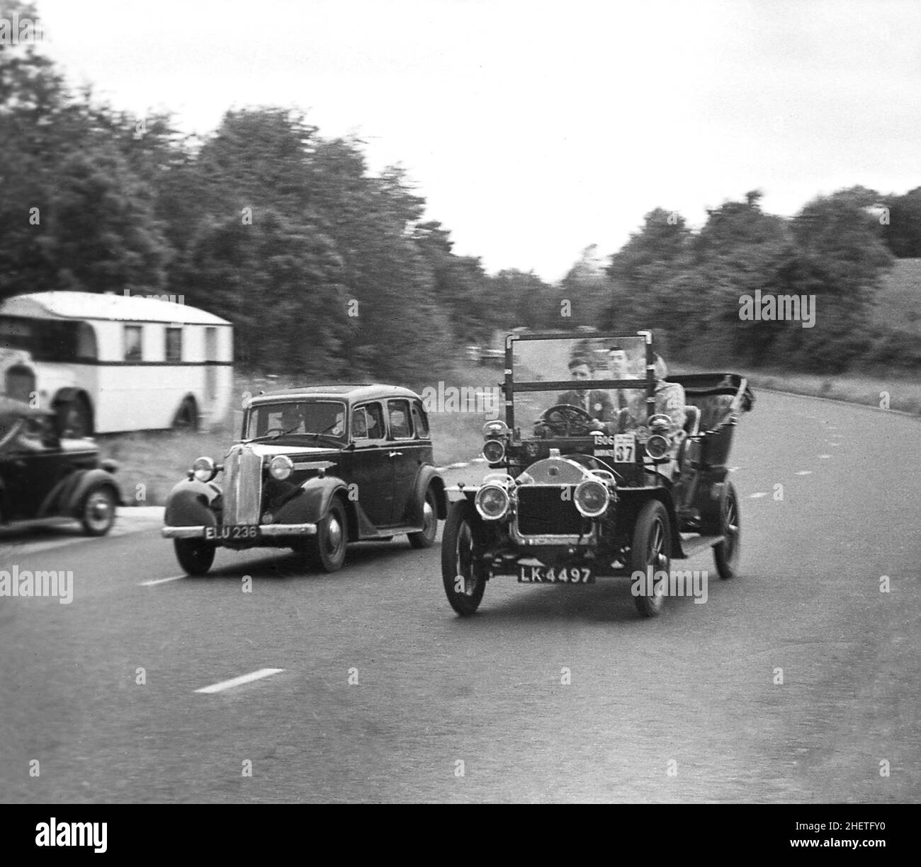 1950s, historical, a veteran car taking part in the London