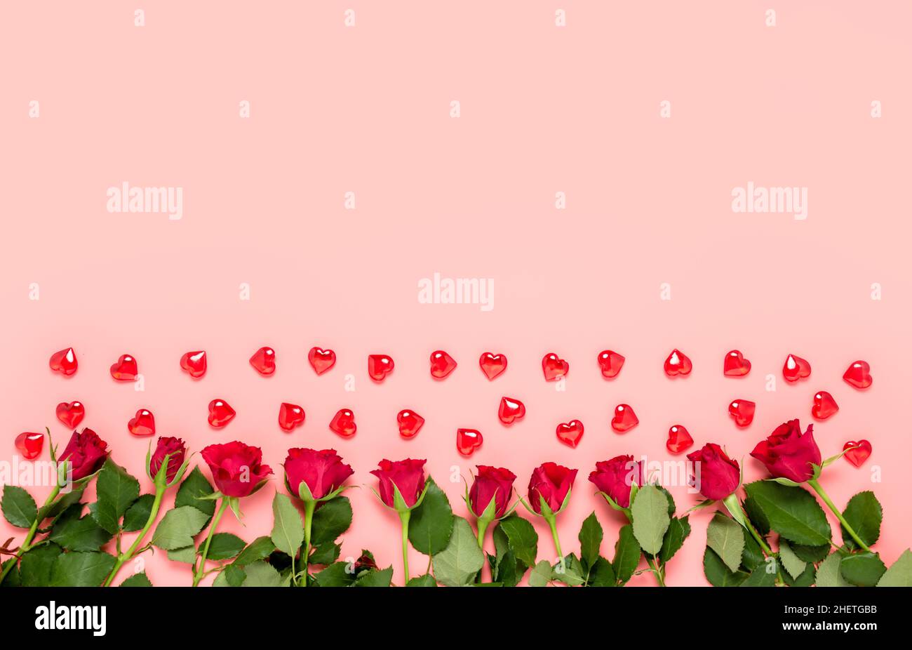 Pink Valentine's day background with red roses and hearts in bottom and ...