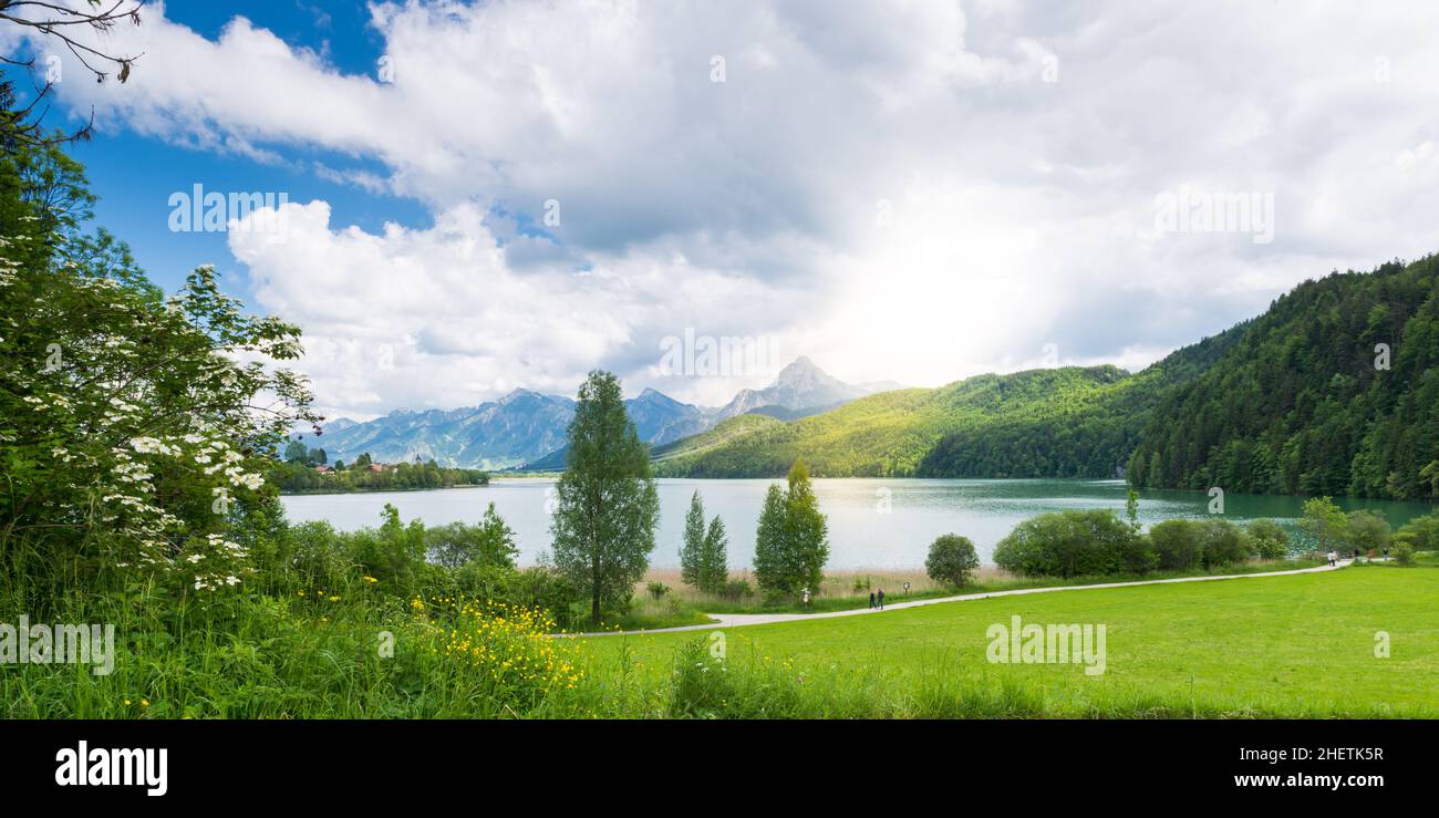 lake weissensee in bavaira with sun coming out through clouds Stock Photo